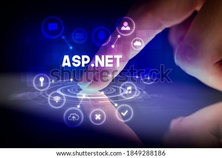 Finger touching tablet with web technology icons and ASP.NET inscription, web technology concept