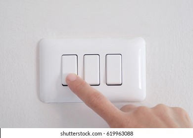 Finger Turn Off Switch Of Light On Wall