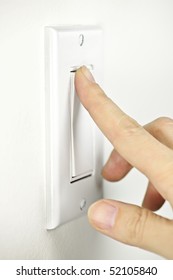 Finger Turning White Light Switch On Or Off