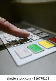 Finger Using Automatic Teller Keypad To Enter Pin Number