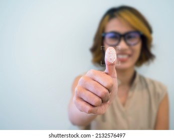 Fingerprint icon with woman thumb wearing glasses scanning for security access with biometrics identification on white background with copy space. Business technology safety internet network concept.