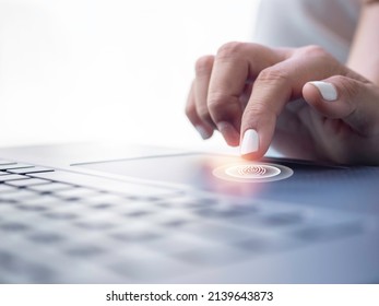 Fingerprint scan icon on touchpad on laptop computer while finger scanning for security access with biometrics identification. Cyber security, privacy data protection technology for business.