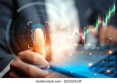 Fingerprint scan provides security access with biometric identification. Businessman using fingerprint indentification to access personal financial data. Technology Safety and biometric security.