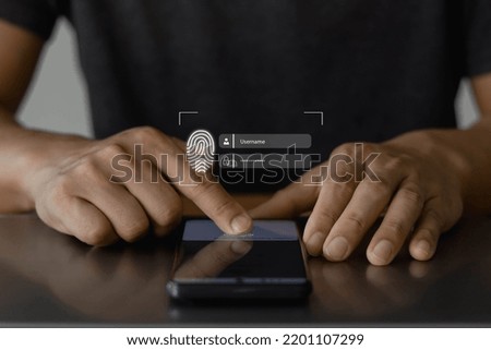 Fingerprint scan for secure access to protected data network with biometrics. Person using finger print authentication technology on mobile smartphone to login on private system.