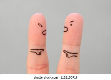 Fingers art of family during quarrel. Concept of man and woman blaming each other.
