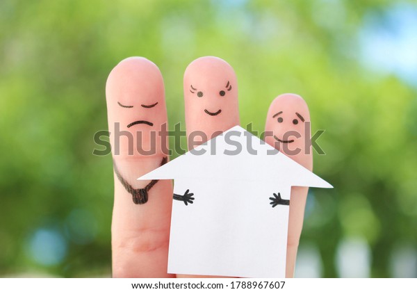 Fingers art of family during quarrel.\
Concept of man and woman divide house after\
divorce.