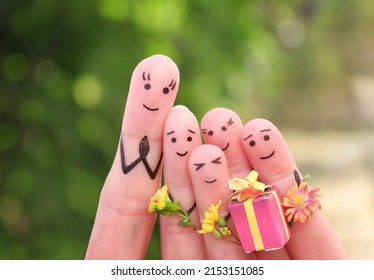 Fingers art of happy people. Concept schoolchildren give flowers to the teacher. Mother's Day. Knowledge Day. Teacher's Day.