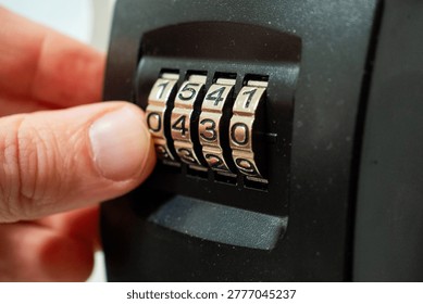 Fingers Dialing Code on Key Safe Number Wheels