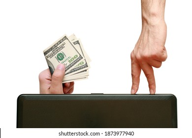 fingers going the laptop to the hand holding dollars