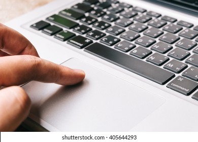 Fingers of man pressing laptop keys - Shutterstock ID 405644293