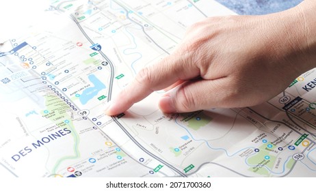 fingers pointing at the map