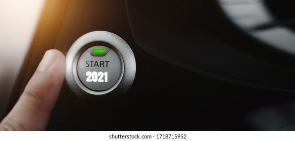 Fingers are poking at the icon button to start the new year, the idea of starting the new year 2021 - Shutterstock ID 1718715952