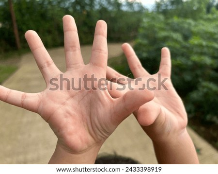 Fingers of ten fingers with background blur