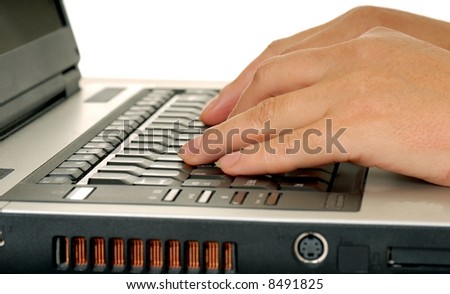 Fingers typing on a computer keyboard isolated