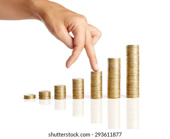 Fingers walking up on stacks of coins isolated on white background. Growth Finance Concept  