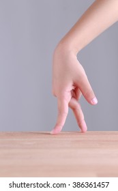 fingers walking on wooden table, walking concept