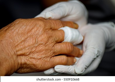 Fingers Wound Elderly Care On Nurse Hand. 
