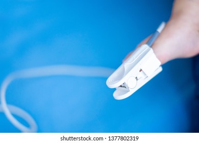 Fingertip Pulse Oximeter On Toe Of Little Baby Child