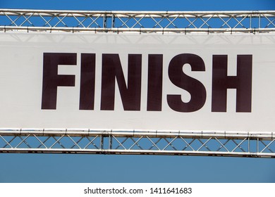 Finish Line Banner In A Metal Framework, Across A Clear Blue Sky