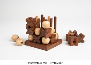 The finished game of tic-tac-toe. Three-dimensional wooden voluminous field for tic-tac-toe competition. The winner of the battle.