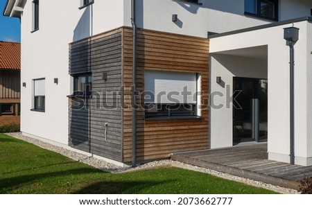Finished house with fast construction, wooden cladding, economical environmentally friendly technology. Modern, elegant, minimalist style passive house with recycled materials. Tiny house with a youth