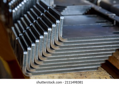 The finished product after bending on a sheet metal bending machine. Bending of various products at the metalworking plant.