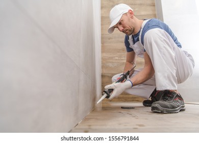 Finishing Bathroom Remodeling. Using Silicone To Seal Ceramic Tiles Corners. Construction Industry.