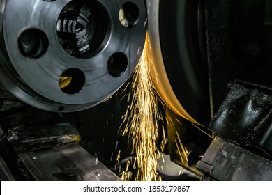 Finishing metal processing on a cylindrical grinding machine in the metalworking industry - Shutterstock ID 1853179867