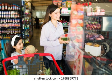 Finishing A Trip To The Grocery Store. Cheerful Woman And Customer Paying For Food And Fresh Produce At The Supermarket Checkout Counter  