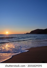 Finisterre Sunset in Galicia, Spain. Mar de Fora beach and Nave cape in Costa da Morte. 