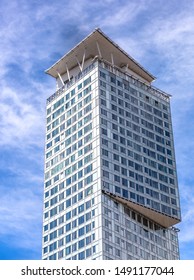 Finland, Helsinki - July 24th 2019: 
 Modern Glass Building Skyscrapers With Blue Clouds. Business District Background.