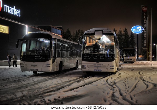 Finland, Imatra, 08,11,2014 Tourist buses in a\
parking lot in the\
winter