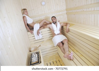 Finland Sauna Warming Up And Healing In A Spa Wellness Resort Cabin With Young Couple