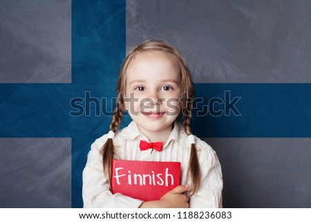 Finnish concept with little girl student with book against the Finnish flag background. Learn language