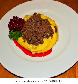 A Finnish Main Course Of Sauteed Reindeer With Cranberries And Mashed Potatoes