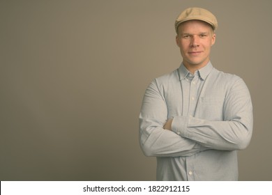 Finnish Man Wearing Hat Against Gray Background