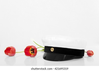 Finnish Student Cap, Ylioppilaslakki With Tree Red Tulips And White Background