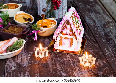 Finnish Traditional Christmas Table.with Candles And Gingerbread House. Top View. Rustic Style