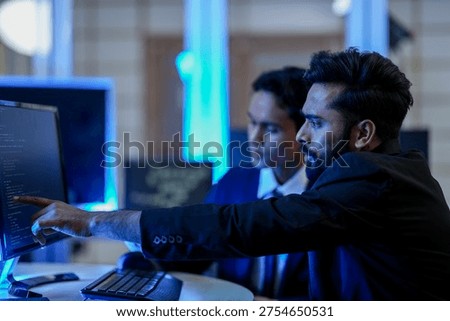 Fintech data scientists analyzing algorithmic trading patterns on digital dashboard. Financial analysts evaluating blockchain cryptocurrency market trends.