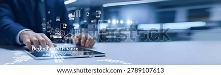 Fintech expert holding blockchain interface. Decentralized Finance uses blockchain to provide open, transparent financial services without intermediaries.