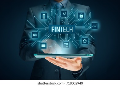 Fintech (financial technology) concept. Business person with tablet and fintech illustration. - Shutterstock ID 718002940