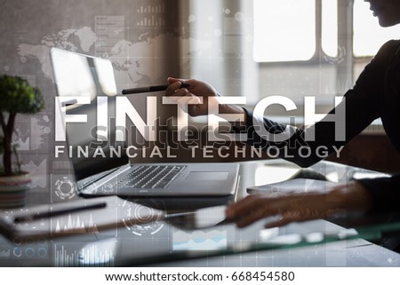 Fintech. Financial technology text on virtual screen. Business, internet and technology concept. 
