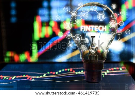 Fintech Investment Financial Internet Technology Concept. Light bulb on tablet and Stock graph and business technology icon with abstract electronic circuit background 
