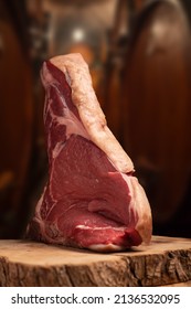 Fiorentina. Standing Rib Beef Roast Raw On Wine Cellar Background Close Up