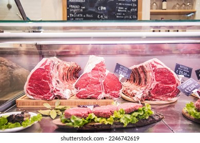 Fiorentine Beef steak - Butcher's shop selling raw meat at traditional italian market stall  - Powered by Shutterstock