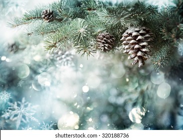 Fir Branch With Pine Cone And Snow Flakes - Christmas Holidays Background
