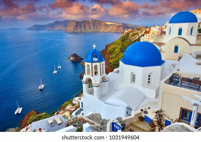 Fira town on Santorini island, Greece. Incredibly romantic sunrise on Santorini. Oia village in the morning light. Amazing sunset view with white houses. Island of lovers - Shutterstock ID 1031949604