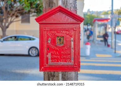 Fire Alarm Inside The Small Red House On A Wooden Post At Crosswalk In San Francisco, California