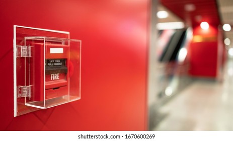 Fire alarm on the wall in subway in Bangkok,  At the Bangkok subway fire warning equipment for emergency. It’s red fire alarm switch  on the wall. Founded un everywhere for the public area.  - Powered by Shutterstock