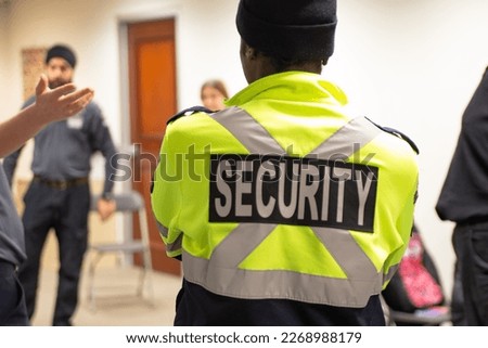 Fire Alarm training class by security guard in office